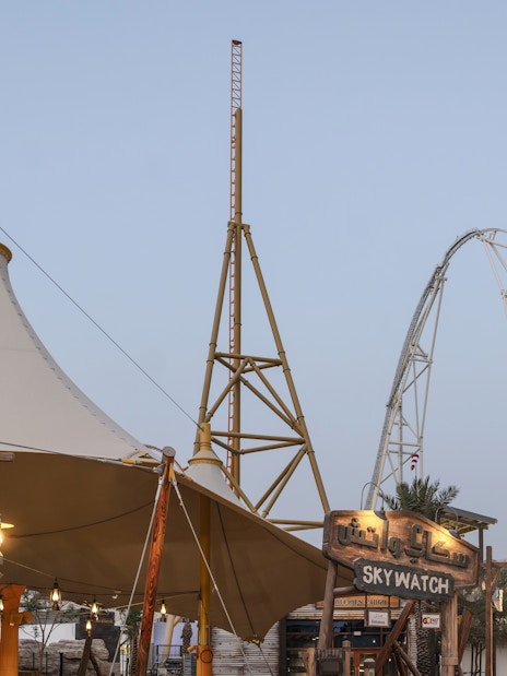 Roller coaster and Skywatch sign at Valley of Fortune, Six Flags Qiddiya City.