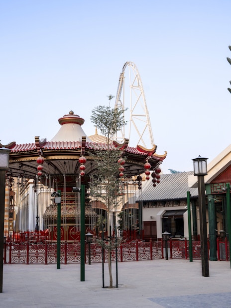 Carousel and dragon sculpture at Six Flags Qiddiya City Grand Exposition.