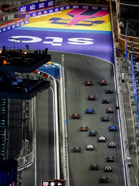 Formula 1 cars racing at night during the Jeddah Grand Prix 2026.