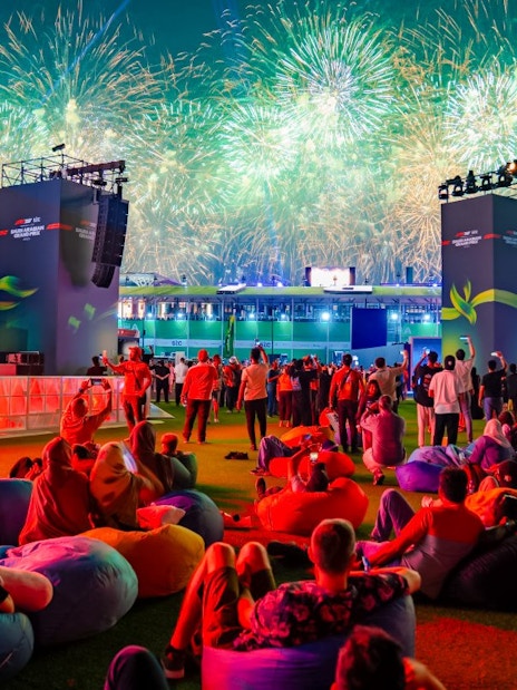Crowd watching fireworks at Formula 1 Jeddah Grand Prix 2026 event.